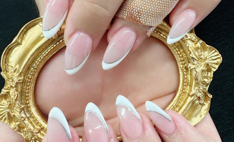 Sheer pink manicure with fine white French tips